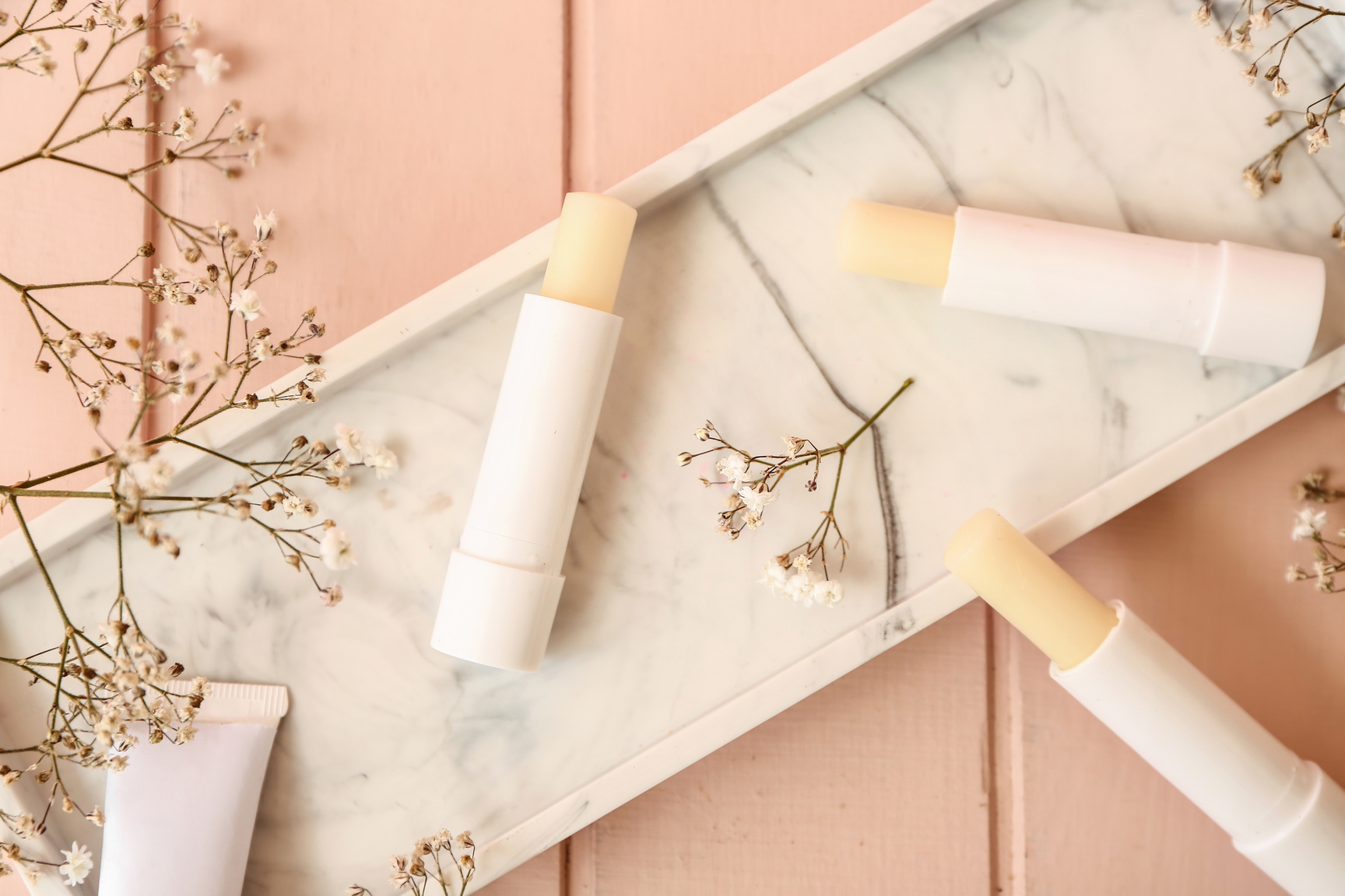 Natural Lip Balms on Wooden Table
